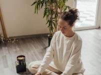 woman in black sweater lying on floor