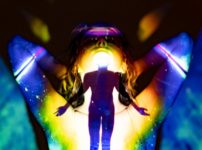 woman in black brassiere and panty with blue and purple light